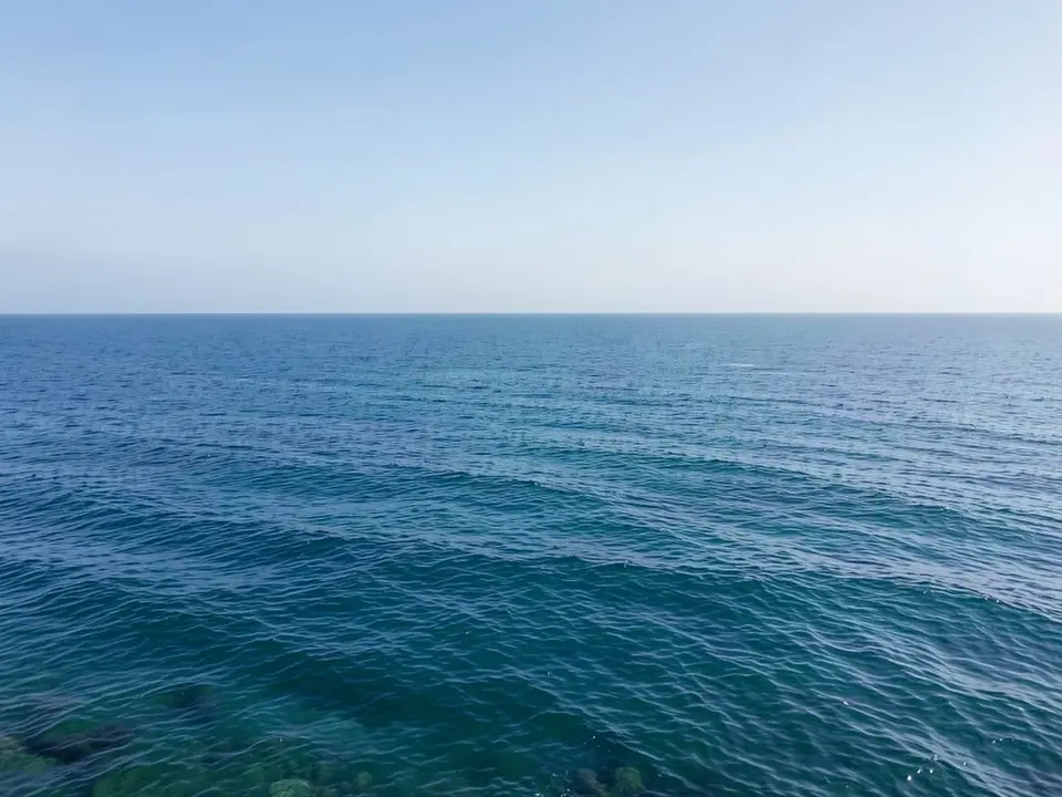 A wide view of the open central Pacific Ocean, where sea surface temperature has exceeded 86 degrees F for the first time on record. AI-generated editorial illustration; not a documentary photograph