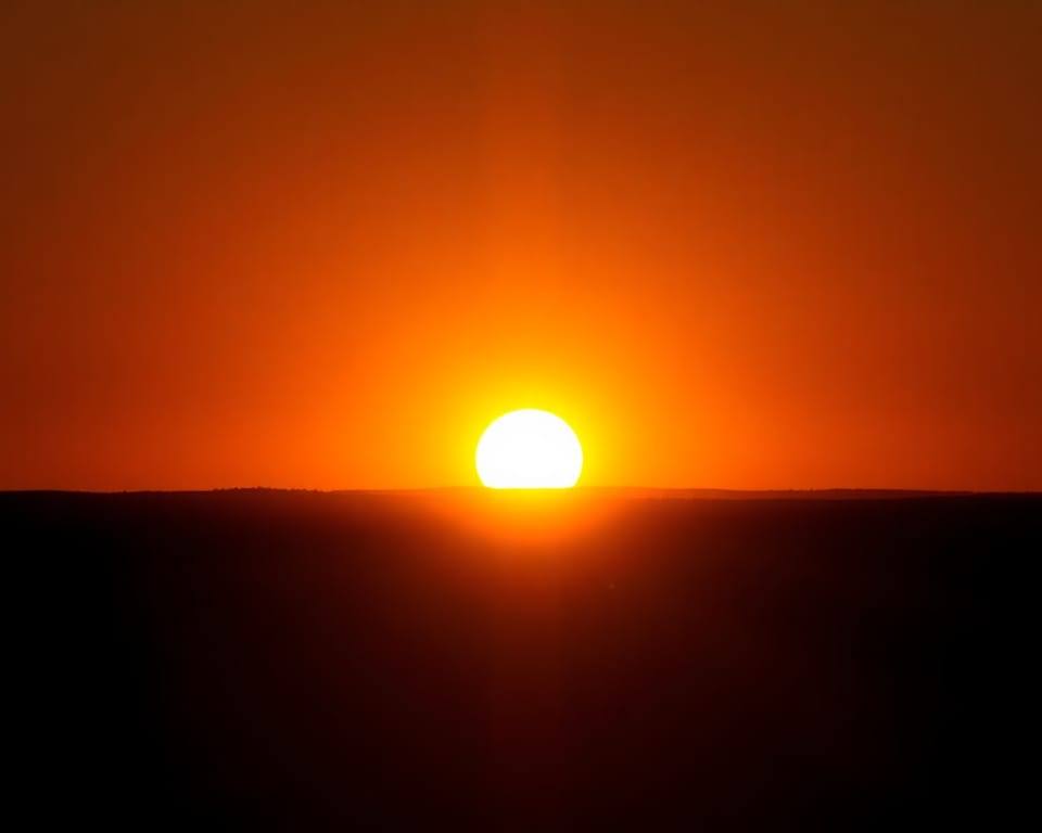 a bright sunrise breaking over a dark horizon, warm golden light spreading AI-generated editorial illustration; not a documentary photograph